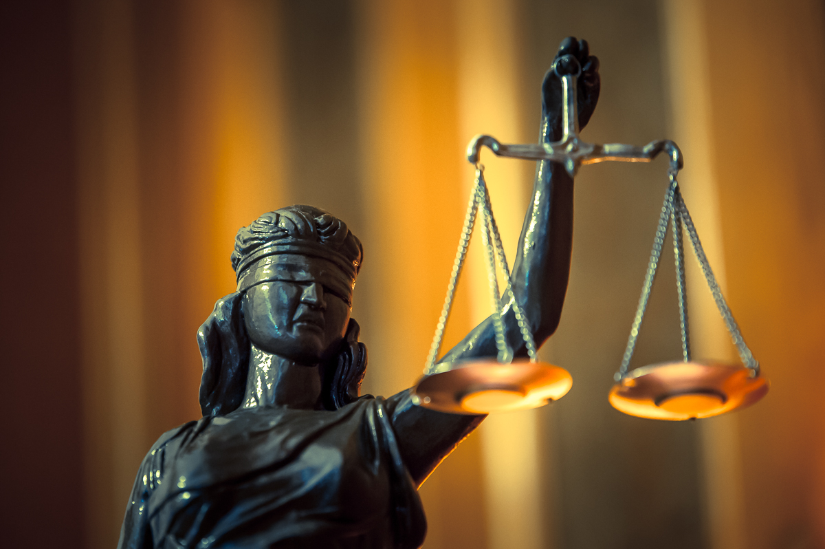 Statue of woman holding scales