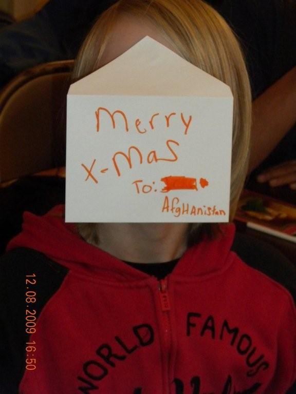 Young childs face covered by envelope